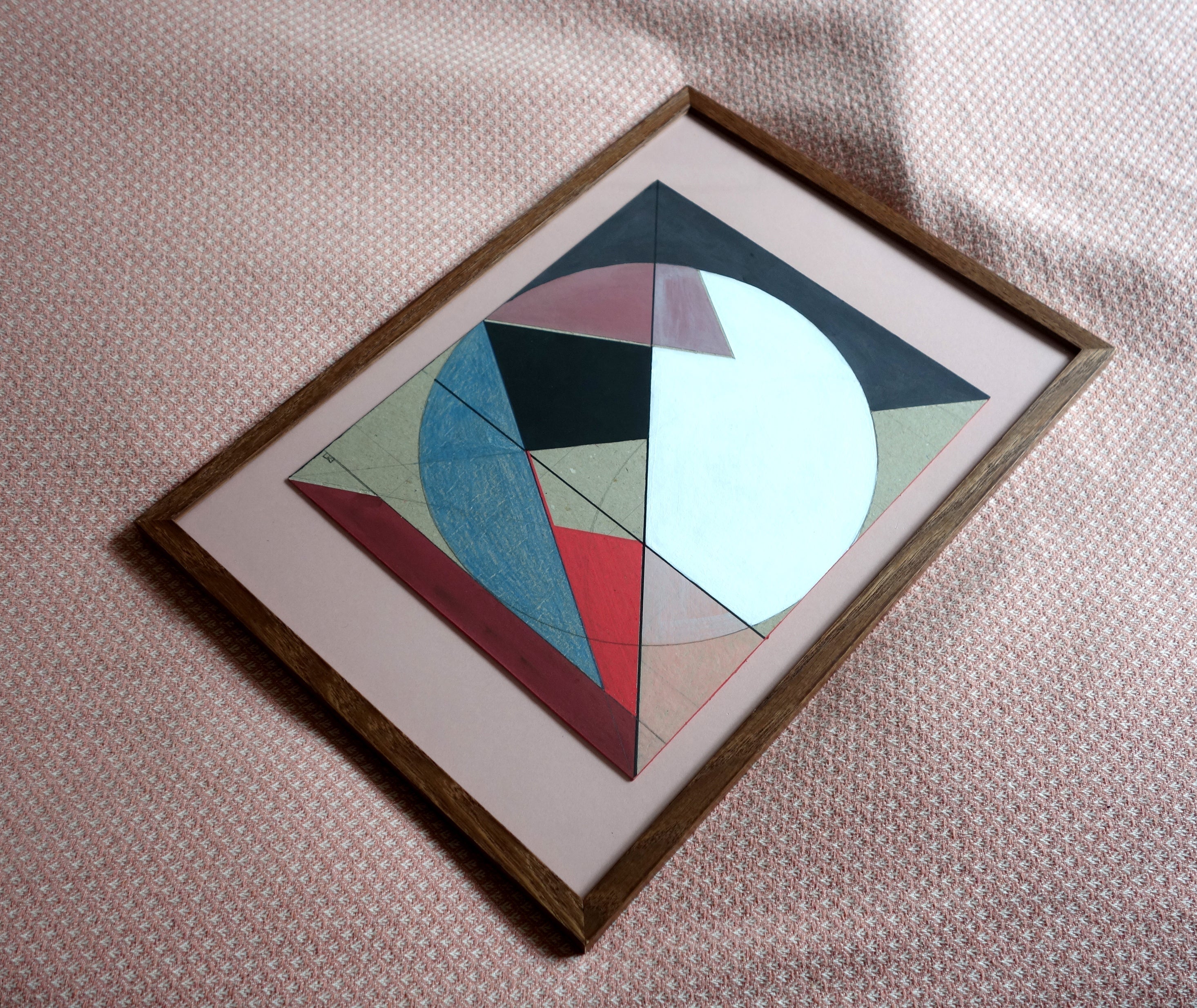 Geometric cardboard art with bold red and black painted edges by Lisa Ketty