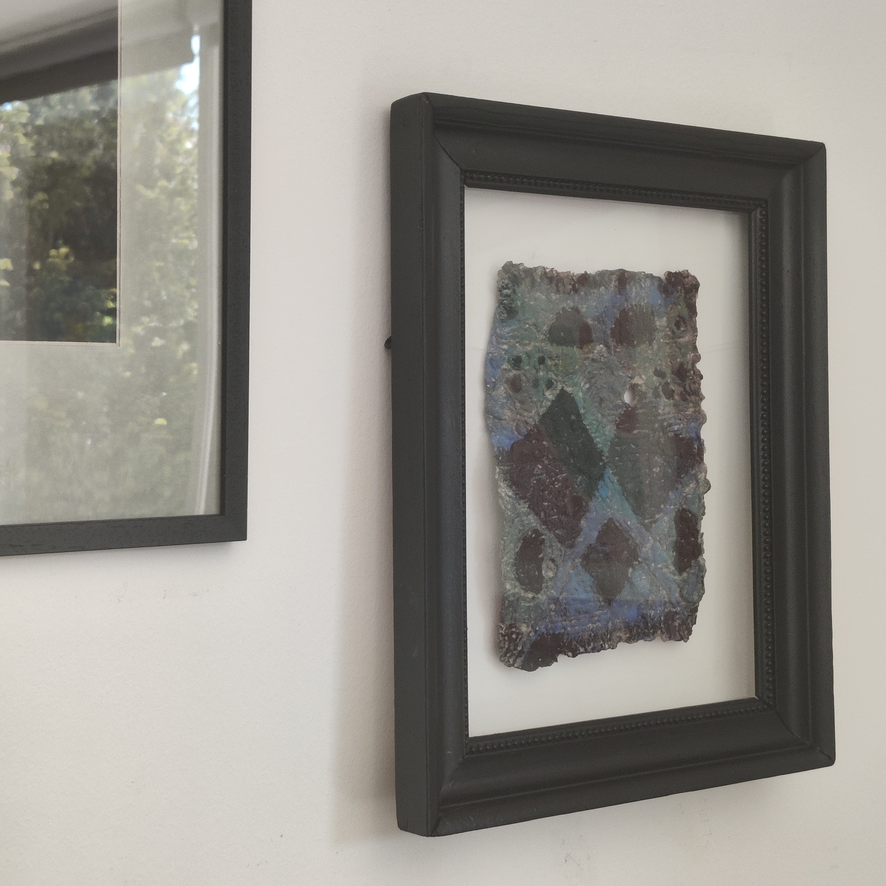 The paper pulp floating cloth framed - close view of texture