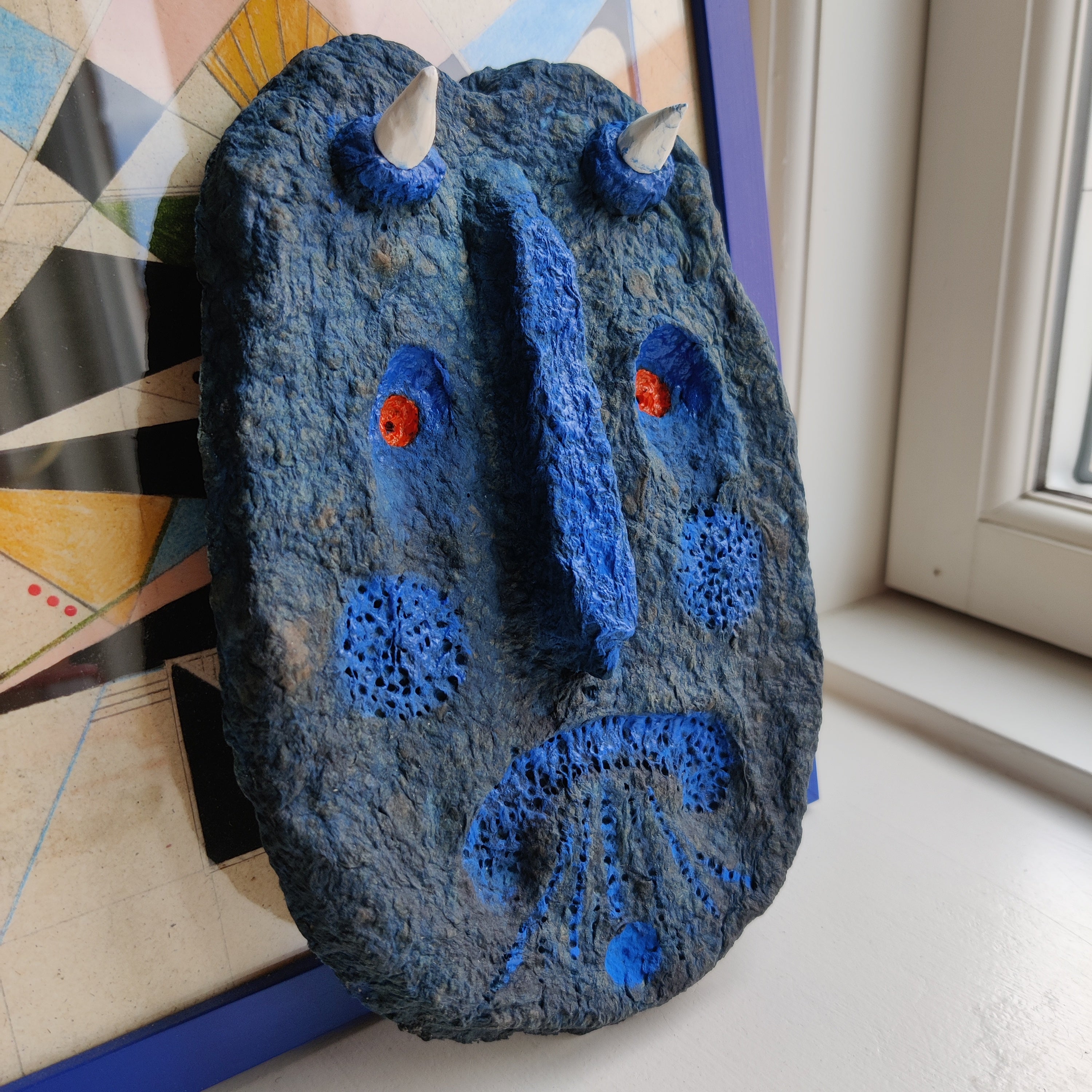A Blue Devil made to scare evil away paper pulp sculpture by Lisa Ketty