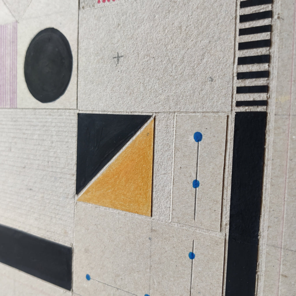 Close-up detail of layered cardboard relief art showing dimensional depth