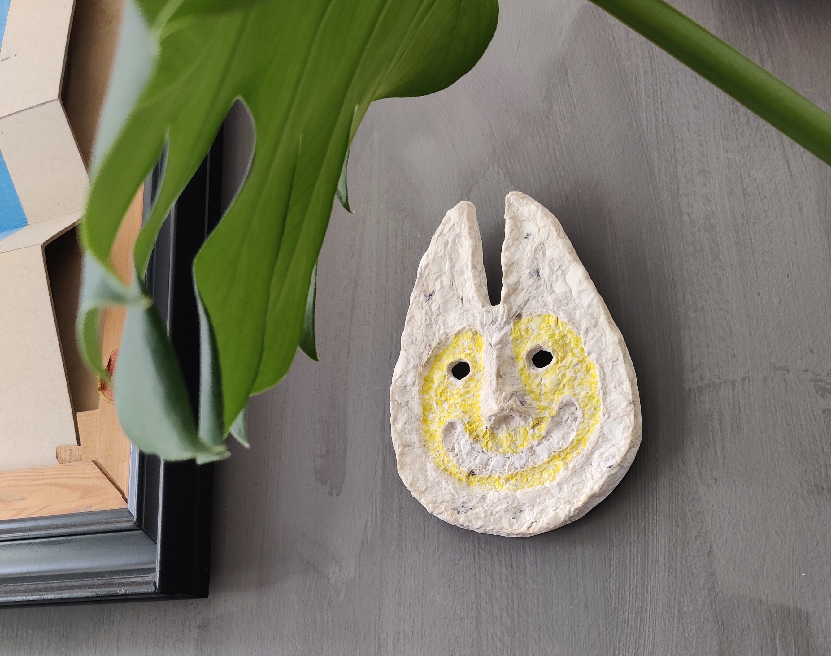 Rabbit Man paper pulp mask, side profile showing depth and texture