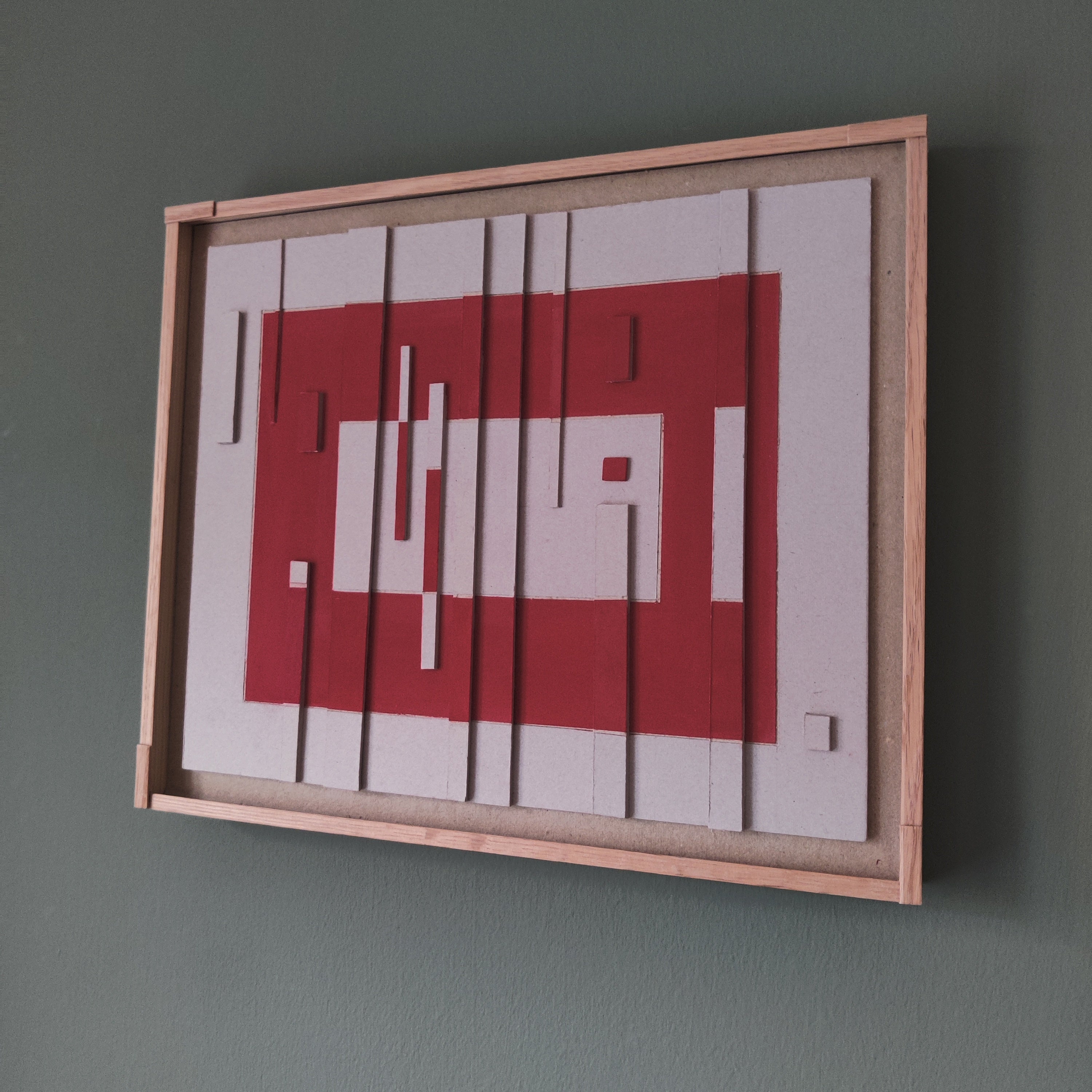 hanging on a green wall