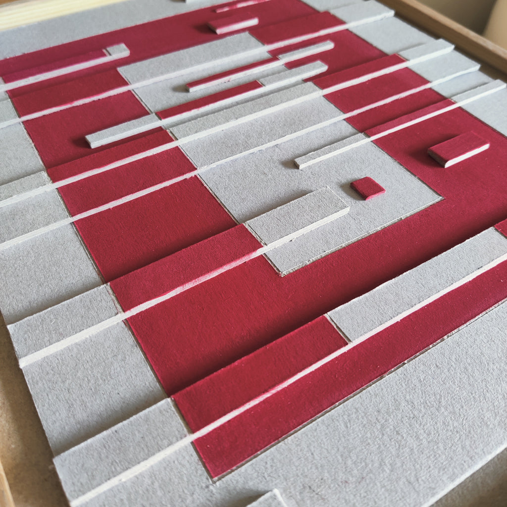 Close-up of a red and gray geometric patterned surface