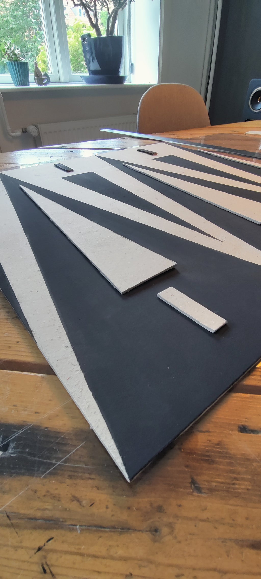Black and white geometric design on a wooden table