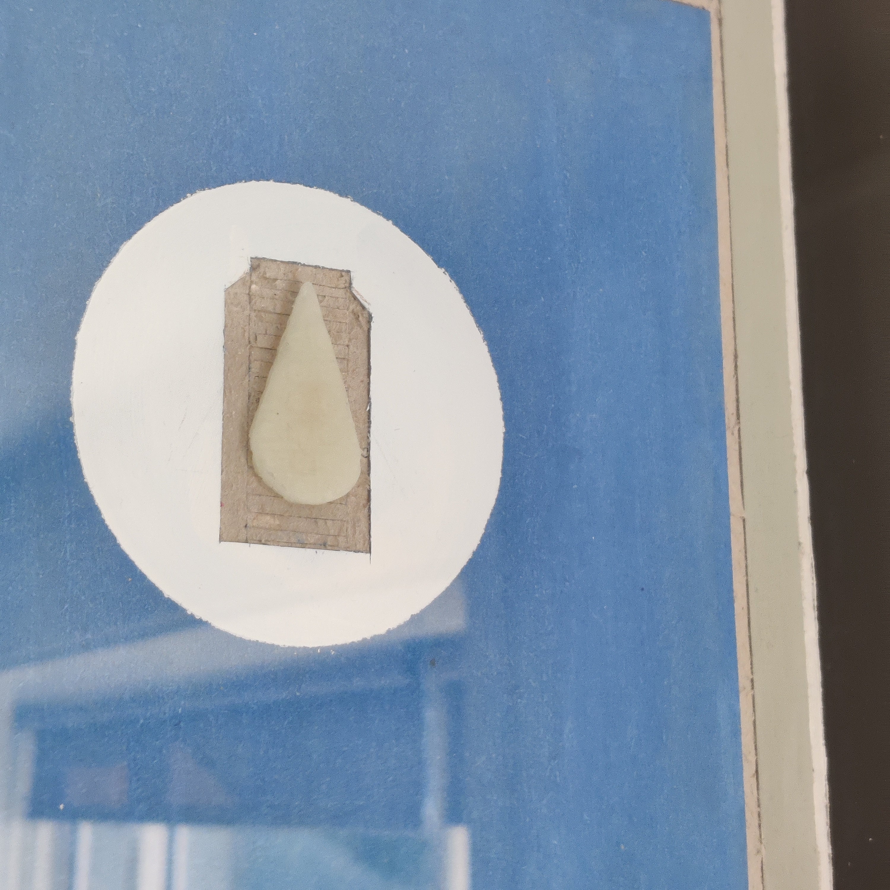 Close-up of the drop of mmilk, that can glow up in the dark
